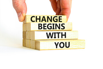 Change begins with you symbol. Concept words Change begins with you on wooden blocks on beautiful white table white background. Businessman hand. Business motivational change begins with you concept.