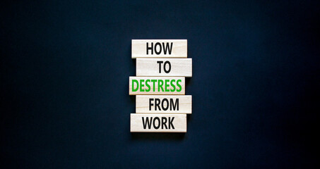 Destress from work symbol. Concept words How to destress from work on wooden blocks. Beautiful black table black background. Copy space. Psychological business destress from work concept. Copy space.