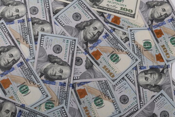100 dollars.there are many of them. background. close-up