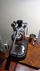A coffee machine placed in the kitchen always ready and hot.