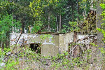 Broken destroyed old house in forest Germany.