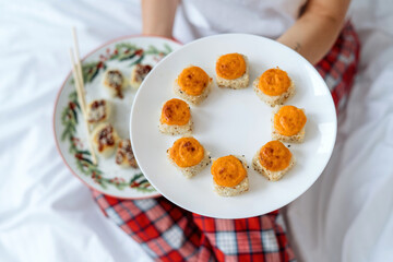 Baked Maki roll with cheese on ceramic plate. Japanese menu concept.