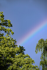 rainbow in the skyblue sky with clouds, nacka, sverige, sweden,stockholm