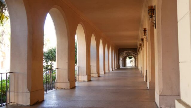 Spanish colonial revival architecture, Balboa Park, San Diego, California USA. Historic building, classic baroque or rococo romance style. Arches and columns of Casa, archway, vault, arcade or passage