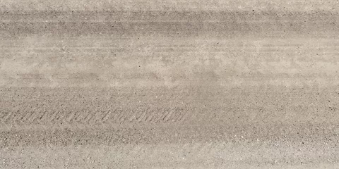 Foto op Canvas panorama of surface from above of gravel road with car tire tracks © hiv360