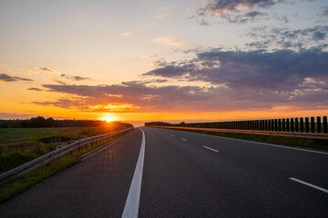 empty highway during a spectacular sunset