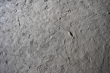 human foot prints in dust, shoes or people left prints in the sand, texture