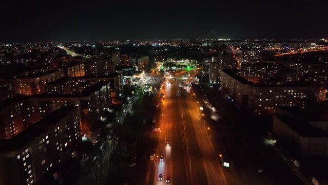Aerial view Night Avenue of the big city of Lviv in Ukraine. Car traffic at night. Nightlife of a European city.