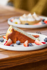 cheesecake with fresh strawberries and blueberries dessert - healthy organic summer dessert pie cheesecake. Vanilla Cheese Cake.