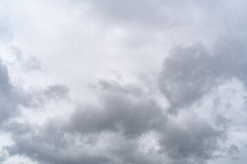 Fototapeta premium Sky with stormy gray cumulus clouds during rainy gloomy weather as background.
