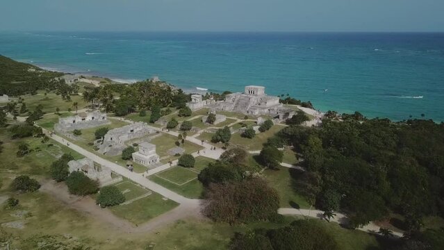 Aerial footage of Tulum ruins, Riviera Maya, Mexico. Drone fly forward toward the castle. This is the biggest mayan pyramid on the caribbean  coast and probably the most famous. 