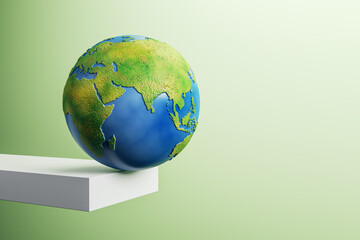 Abstract image of globe on edge of white block trampoline and mock up place on green background. 3D...