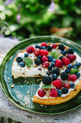 Summer tart with cottage cheese cream with raspberries, blueberries, blackberries, gooseberries.