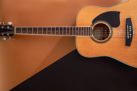 Flat lay, music background with acoustic guitar.