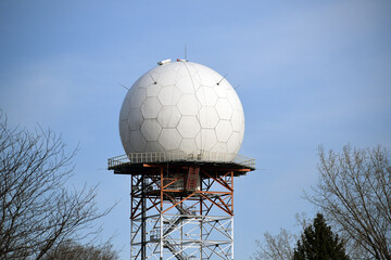 Approach Radar on top of a steel tower, under a clear blue sky