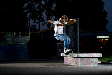 Inline Skater doing a grind on bench