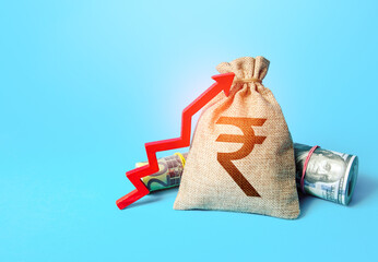 Indian rupee money bag and red up arrow. Economic growth, GDP. Increase in the deposit rate....