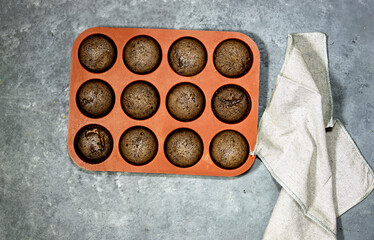 homemade chocolate nuts muffins with napkin
