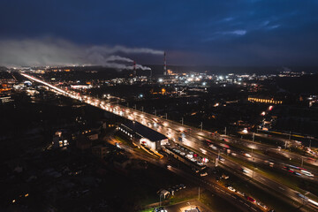 Fototapeta na wymiar Multi-lane road in the European city Vilnius at night from aerial perspective