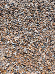 Beach pebble texture in the summer sun