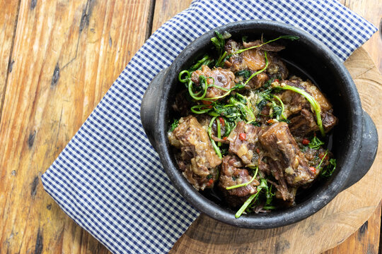 Oxtail with cress. Typical dish of Brazilian cuisine "Rabada".