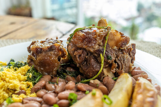 Oxtail with cress. Typical dish of Brazilian cuisine "Rabada".