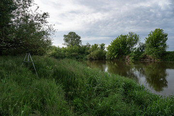 Obraz premium Evening landscape with the last rays of the sun. Morning by the river in summer. Beautiful nature, photo for design