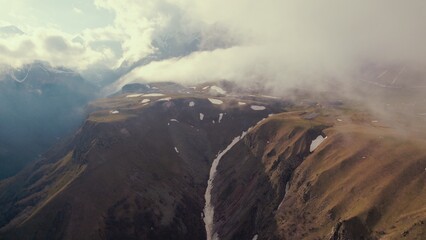 dramatic view of mountains covered with clouds. aerial shot. High quality photo