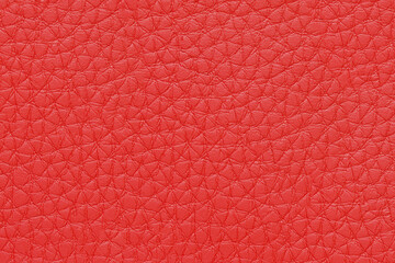 Natural, artificial red leather texture background. Material for sport items, clothes, furnitre and interior design. ecological friendly leatherette.