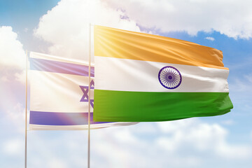 Sunny blue sky and flags of india and israel