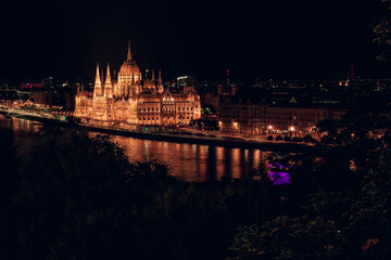 Fototapeta na wymiar Hungarian Parliament and Danube river at night, Budapest, Hungary.