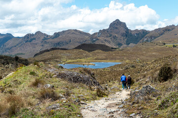 Fototapeta na wymiar Cajas National park, Toreadora lake recreation area. Mountain landscape.Tourists at the pathfoot. Ecuador, Azuay province, close to city Cuenca