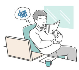 仕事中に書類を見て悩む若いビジネスマン