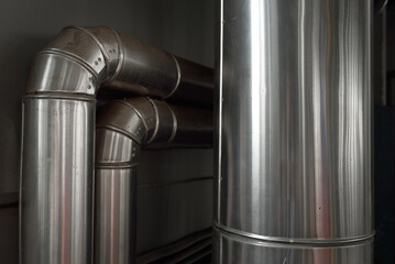 Industrial water treatment and boiler room. Shiny steel metal pipes, piping, connections. Industry,...