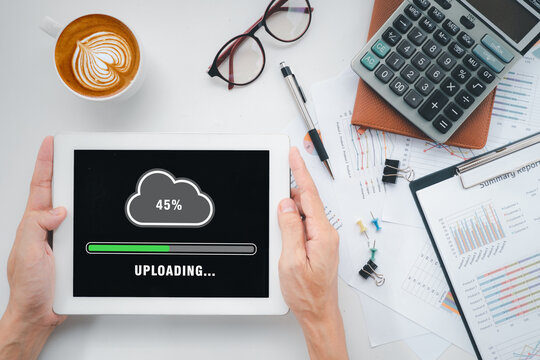 Upload data concept, Person hand using and waiting for cloud uploading on digital tablet, Data infomation, Technology network internet Concept.