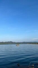 man boating on a calm sea