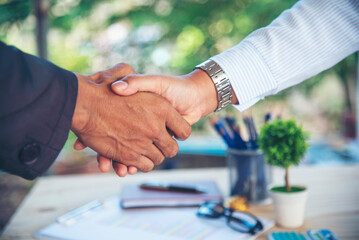 Trust honesty business customer handshake together promise respect partner. Businessman diversity solidarity team multiethnic Partner hands together teamwork. Multiracial meeting shaking hands concept