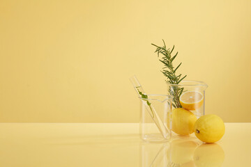 Front view of transparent podium with lemon laboratory equipment and green leaf in beige background science content