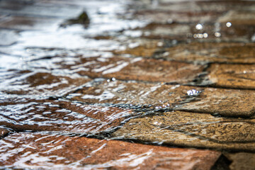 Water running over bricks after rain