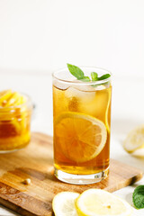 glass of ice lemon tea with mint.