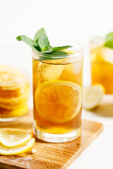 glass of ice lemon tea with mint.