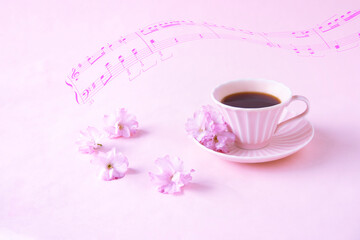 八重桜とピンクのコーヒーカップと楽譜の合成（ピンクバック）