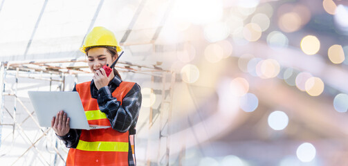 Asian engineer architect worker woman working at build construction site use laptop and talking...