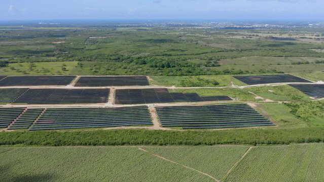 Aerial drone sideways pov of El Soco solar photovoltaic park of San Pedro De Macoris in Dominican Republic