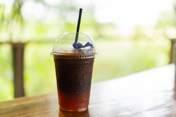 americano with orange juice in take away cup