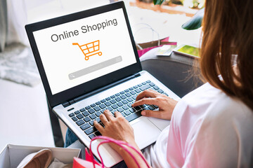 Obraz na płótnie Canvas Woman hands using laptop for ordering fashion items on online website while sitting on couch at home, E commerce business and technology, Digital marketing, Online shopping concept