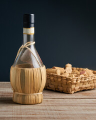 Naklejka premium old craft bottle of wine on wooden surface
