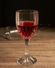 stylized wine glass on wooden base