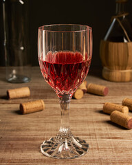 stylized wine glass on wooden base