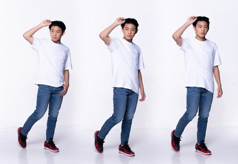 Full length of Asian Teenager Boy, looking at camera, wear white shirt jean pant sneaker.